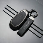 Black leather key cover and fob strap for DENZA car key with textured finish.