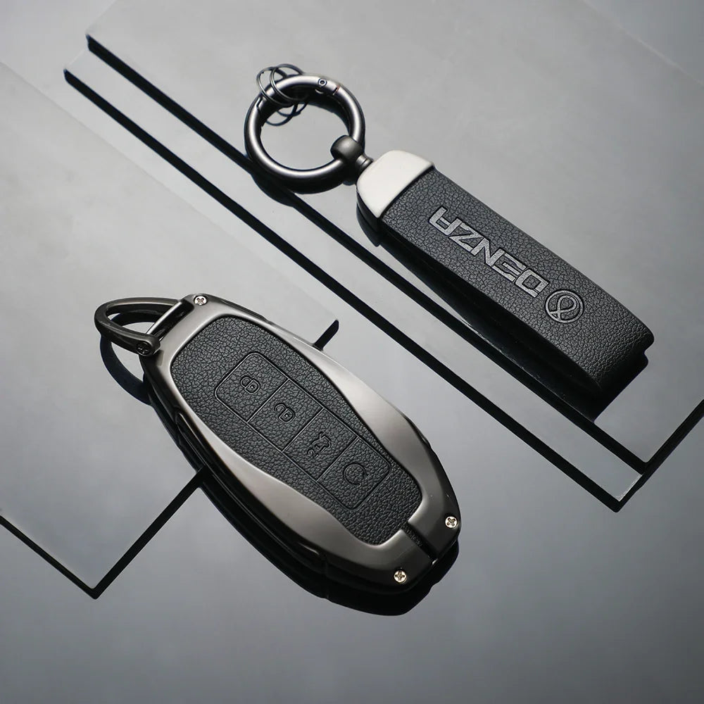Professional black leather and metal key fob covers for DENZA car keys.