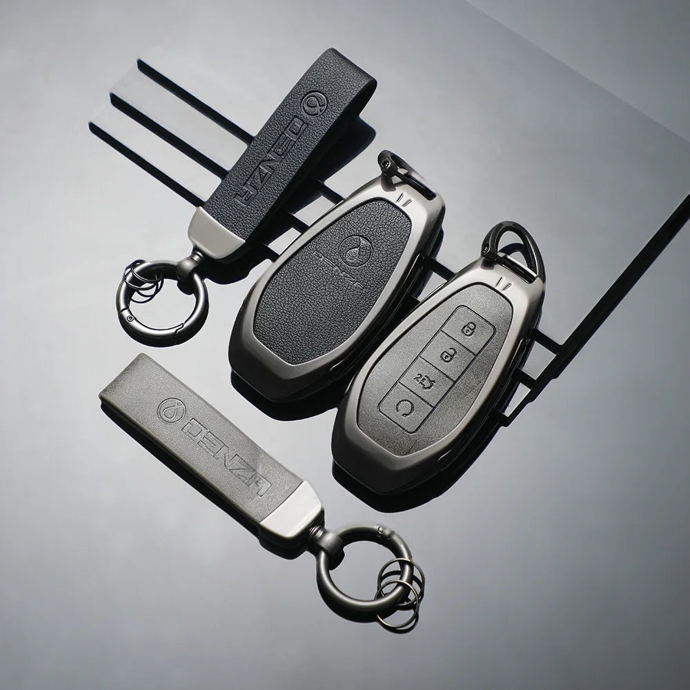 Professional black leather and matte finish Denza car key covers and fobs.