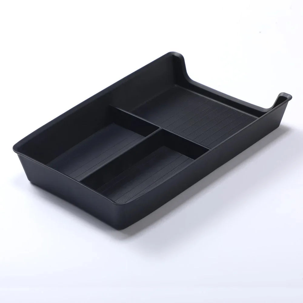 Black plastic car console organizer tray with two compartments for automotive storage.