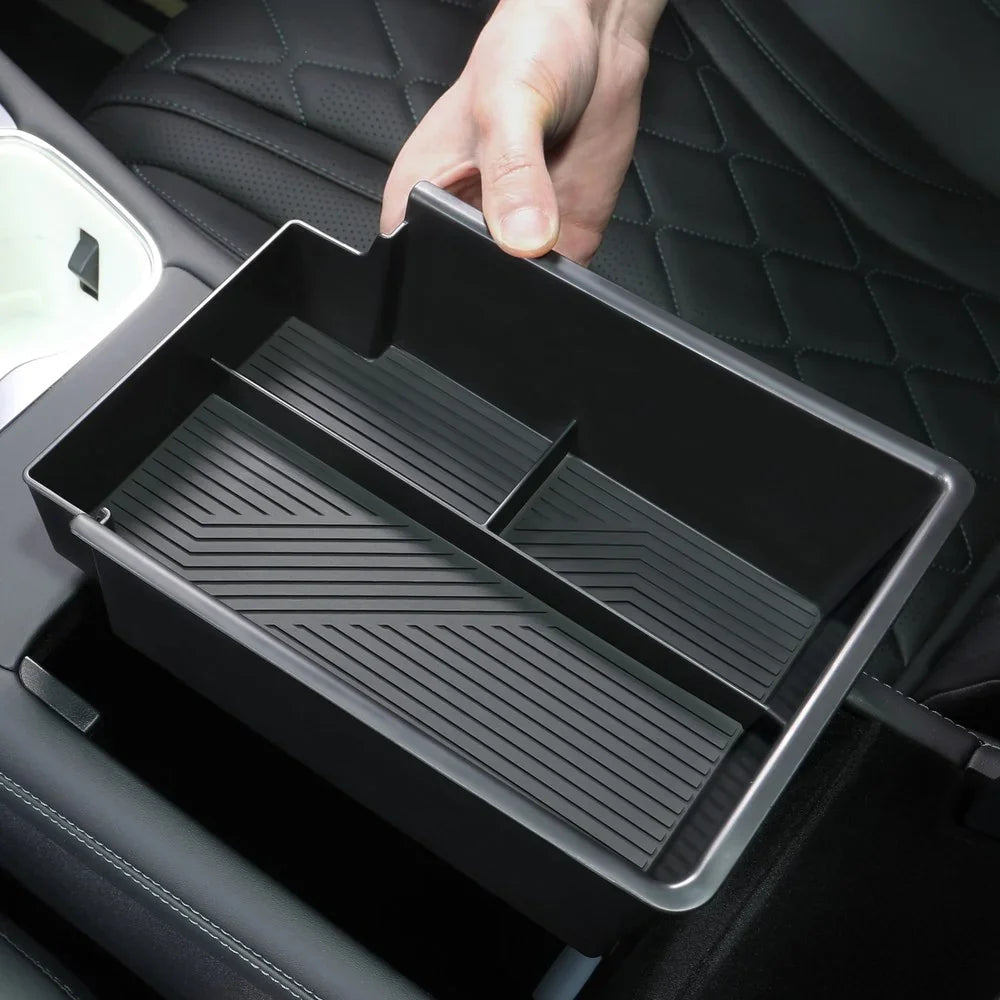 Black matte-finish center console organizer tray with anti-slip ribbed texture for BYD interior.