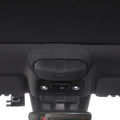 Black fabric-covered interior trim component with a durable matte finish.