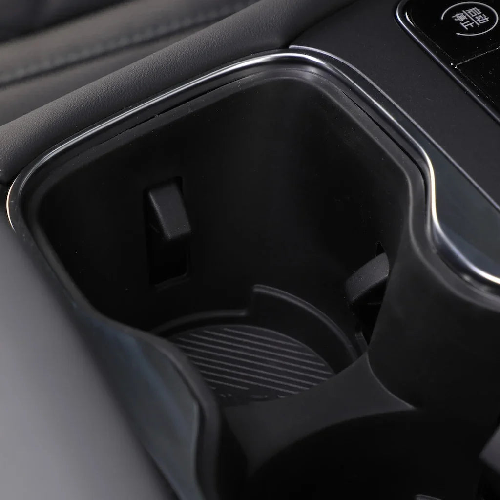 Black textured car cup holder with durable matte finish and non-slip base insert.