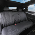 Black quilted faux leather rear car seat covers with diamond stitching for luxury protection.