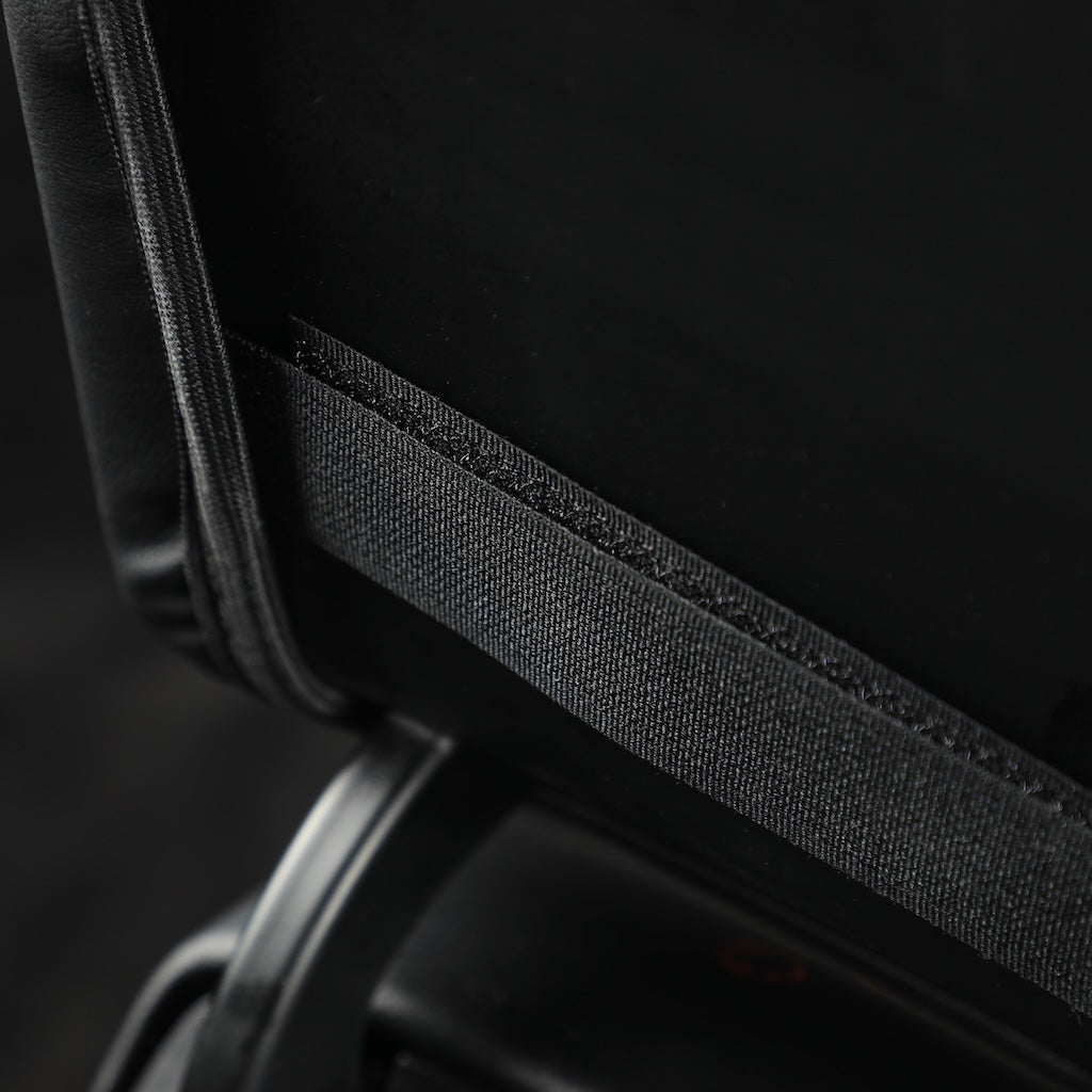Black durable fabric edge detail of a premium car seat protector accessory.