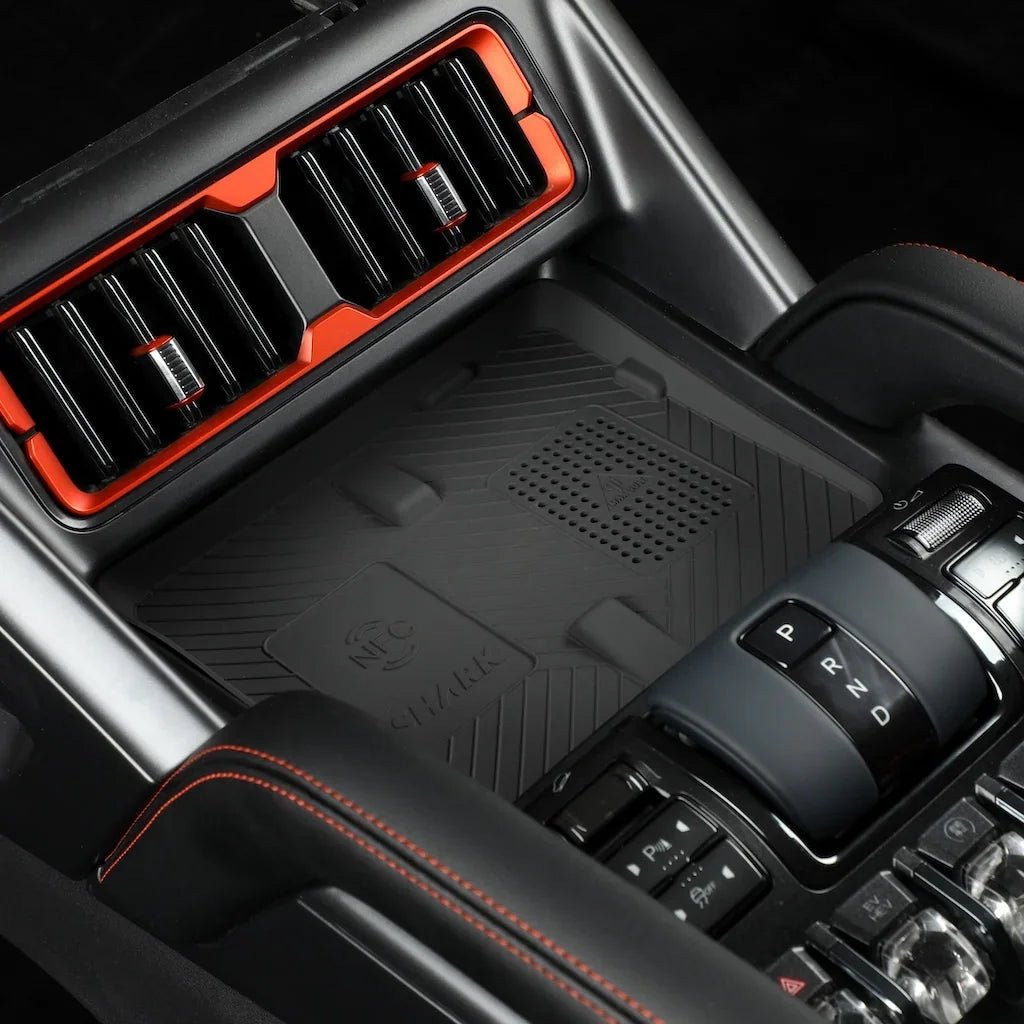 BYD Shark center console with orange accents and textured black materials.