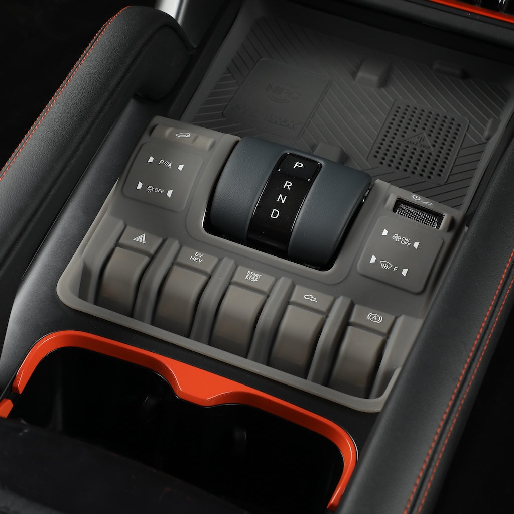 Close-up of a grey center console organizer tray designed for BYD vehicles, featuring a sleek matte finish and custom fit for gear shifts and buttons.