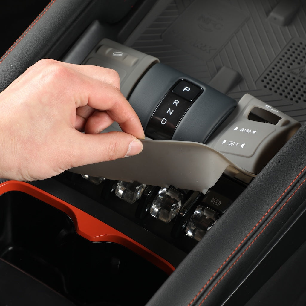 Gray custom-fit protective console cover for BYD gear shifter and center console.