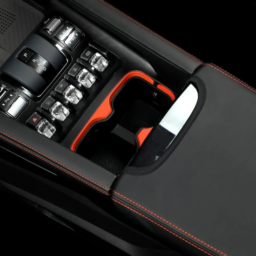 Black leather center console with red stitching and orange trim accents for BYD interior protection.