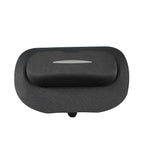 Black textured fabric car headrest cushion with a sleek grey accent strip.