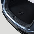 Black custom-fit heavy-duty car trunk mat for premium interior protection.
