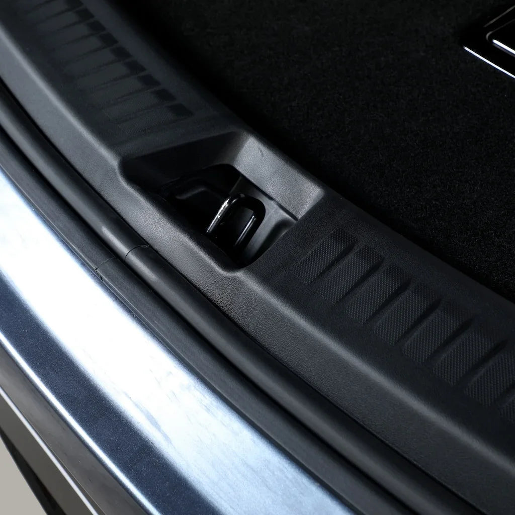 Black durable rubber trunk mat with textured pattern protecting the car cargo area.