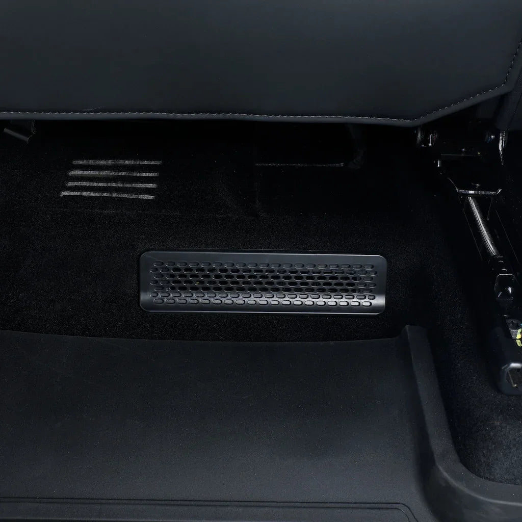 Black custom-fit heavy-duty floor mat featuring a precision-cut ventilation vent cutout.