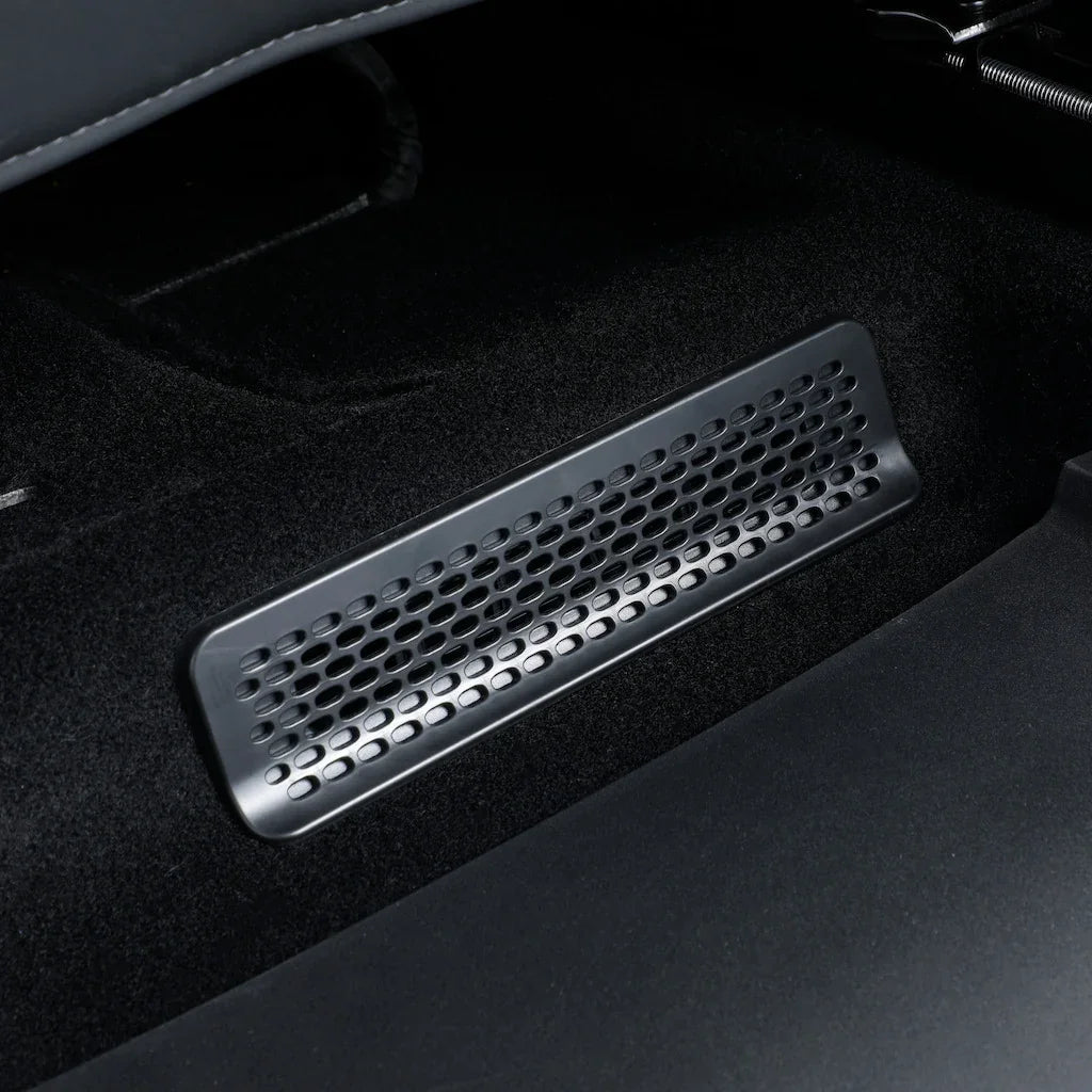Black perforated matte finish floor vent cover for car interior protection.