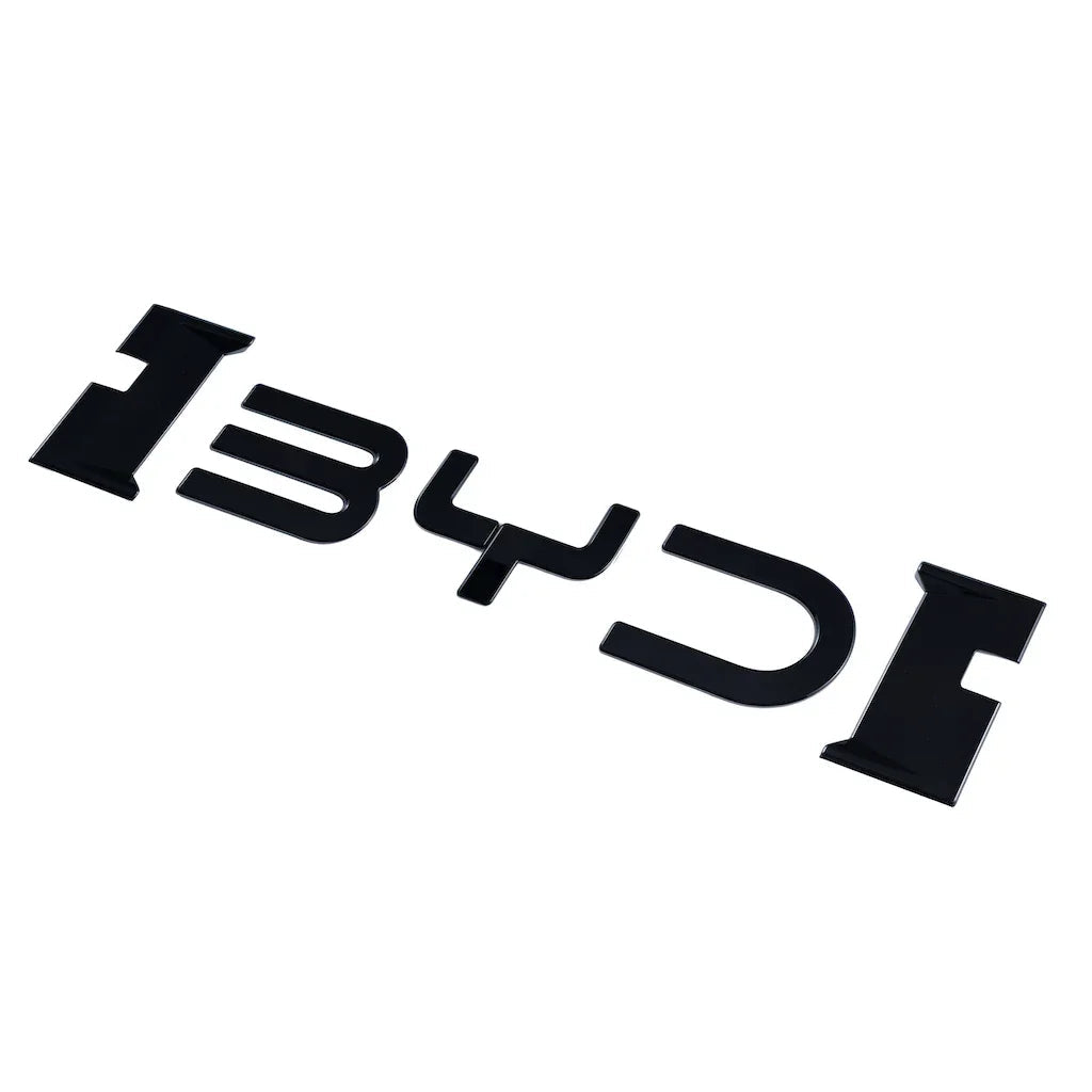Glossy black 3D BYD emblem badge for car exterior decoration.