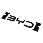 Glossy black 3D BYD emblem badge for car exterior decoration.