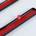 Red and black sleek automotive trim strip with adhesive backing for easy installation.