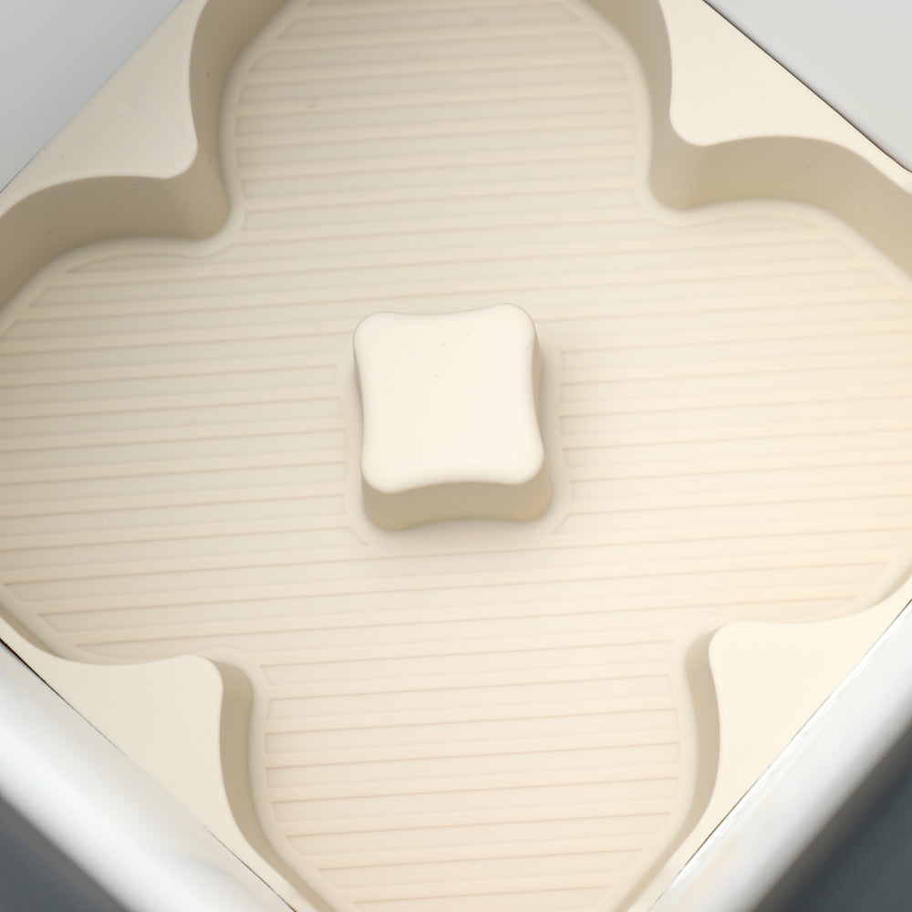 Close-up of a beige TPE car storage tray with a textured non-slip surface.