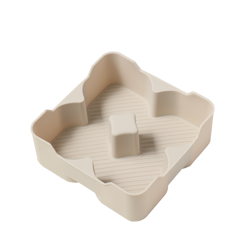 Beige silicone flower-shaped mold with textured interior and central pillar