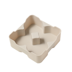 Beige silicone flower-shaped mold with textured interior and central pillar
