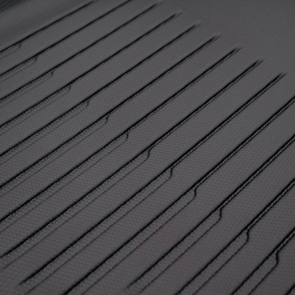 Close-up of grey synthetic leather car mat with professional parallel stitching