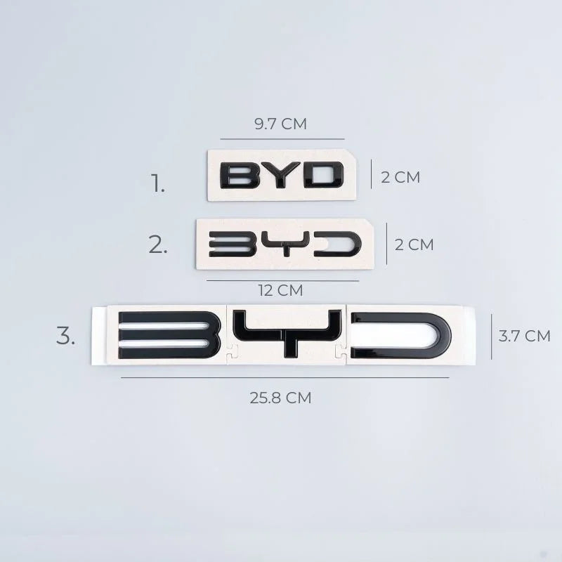 Three sizes of black chrome BYD emblems with precise metric dimensions on white background.