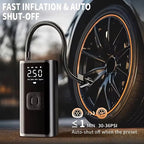 Portable black digital tire inflator with flexible hose inflating a car tire to 30-36 PSI.