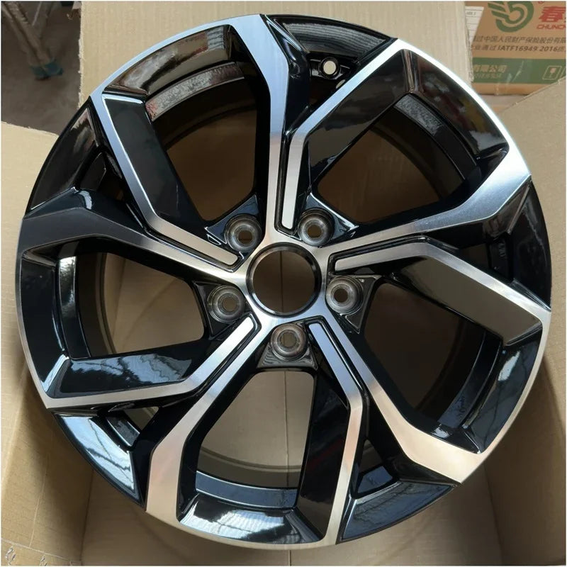 Black and silver dual-tone metallic alloy wheel rim for BYD vehicle protection.