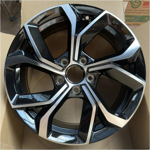 Black and silver dual-tone metallic alloy wheel rim for BYD vehicle protection.