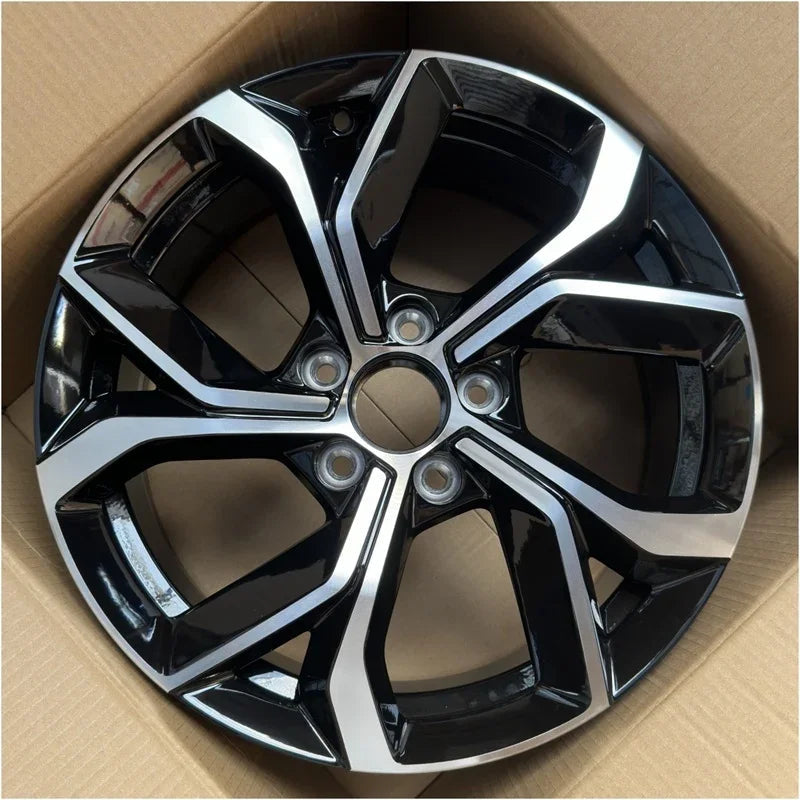 Two-tone black and silver metallic alloy car wheel rim with a sleek geometric spoke design.