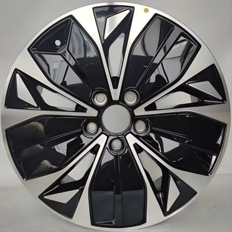 Premium black and silver dual-tone plastic wheel cover with a sleek aerodynamic spoke design.