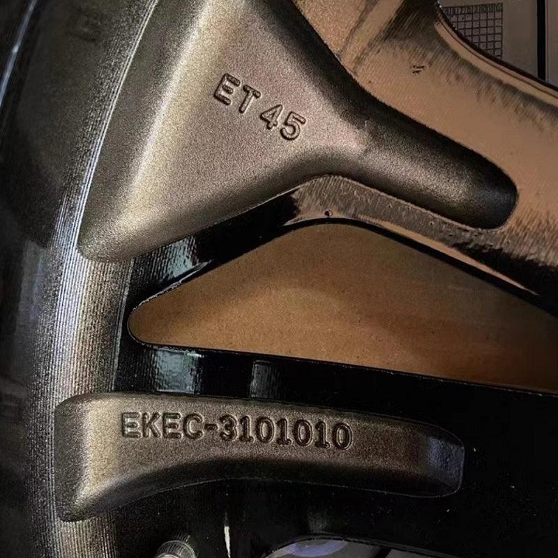 Matte black alloy car wheel rim featuring ET45 offset and EKEC-3101010 serial markings.