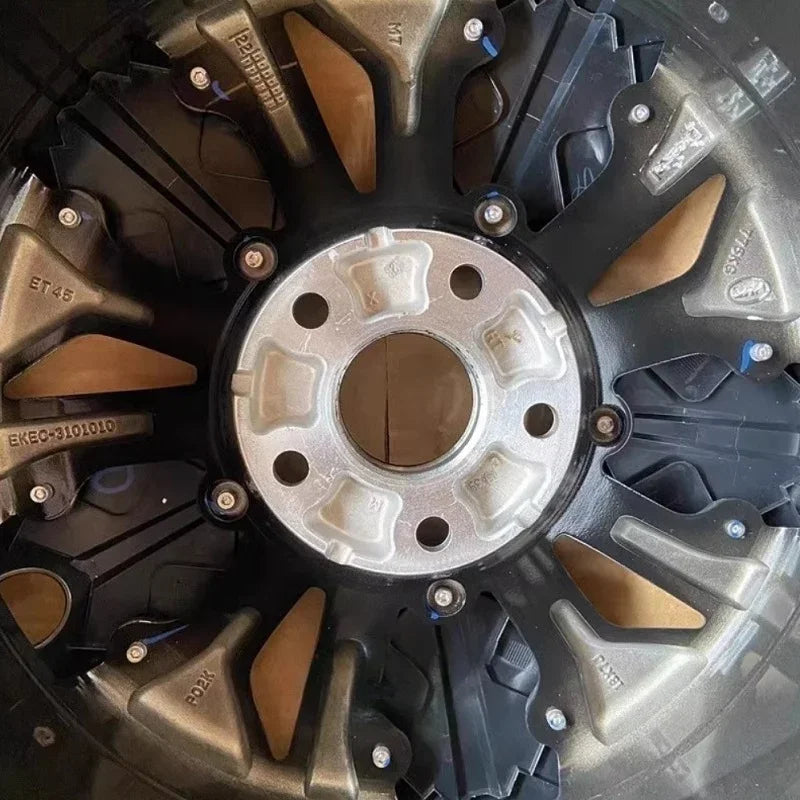Multi-spoke black and bronze alloy car wheel rim with a durable metallic finish.