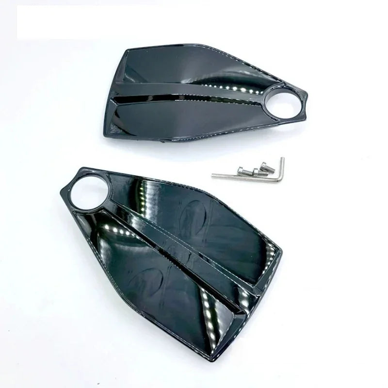 Glossy black carbon fiber texture side mirror covers for BYD vehicles with installation tools.