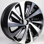Two-tone silver and black machined alloy car rim with a multi-spoke aerodynamic design.