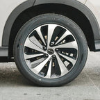 Black and silver multi-spoke alloy wheel with Giti tire on a white BYD vehicle.