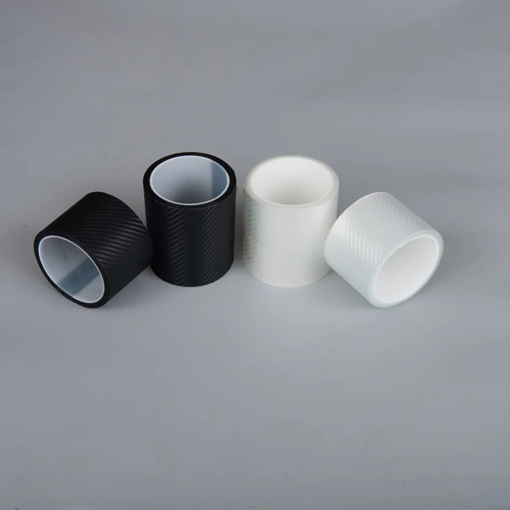Four carbon fiber texture adhesive wraps in black and white colors for car interiors.