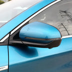 Blue car side mirror with integrated LED turn signal and sleek black trim.