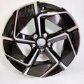Black and silver dual-tone patterned car wheel hubcap with a sleek geometric design.