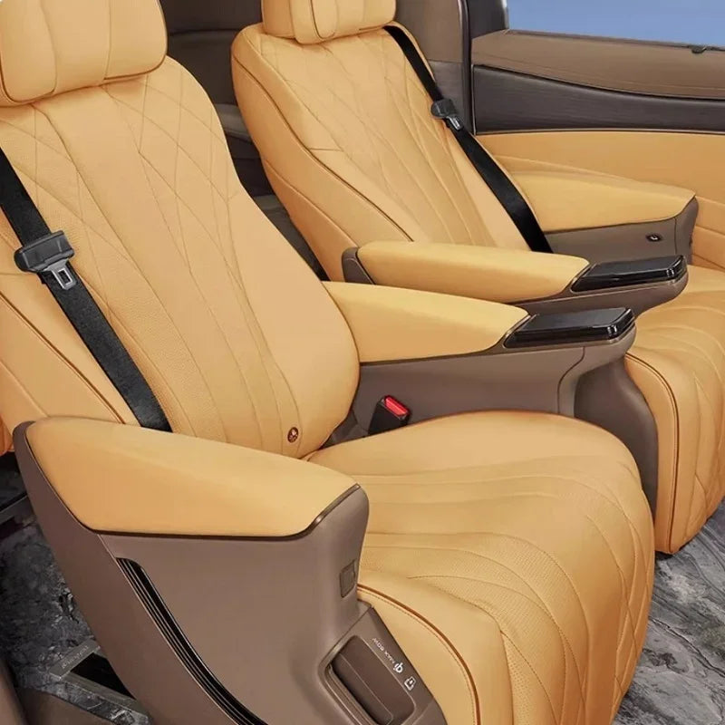 Premium tan leather car seats with diamond quilted stitching and ergonomic armrests.