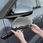 Grey carbon fiber side mirror cover for BYD car showing textured weave finish