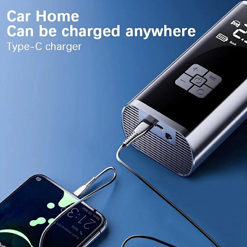 Silver metallic portable power bank with digital display charging a smartphone via Type-C cable.