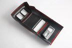 Black carbon fiber texture center console trim with striking red edge accents.