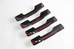 Set of four matte black interior door handle covers with sleek red racing stripes.