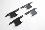Four matte black shark fin antenna covers with sleek aerodynamic design.