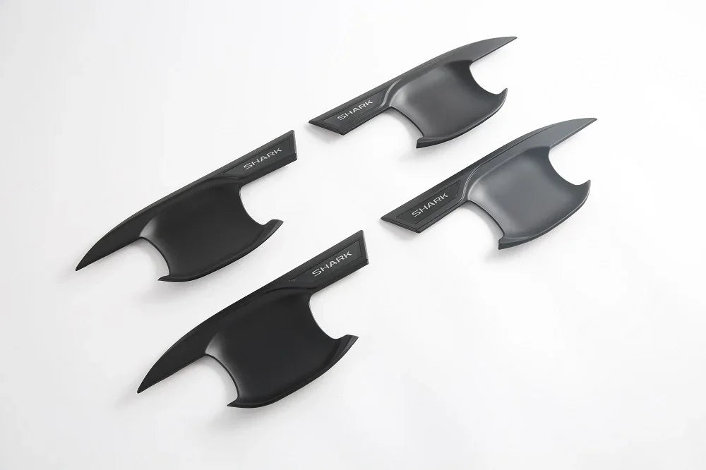 Four matte black shark fin antenna covers with sleek aerodynamic design.