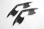 Four matte black shark fin antenna covers with sleek aerodynamic design.