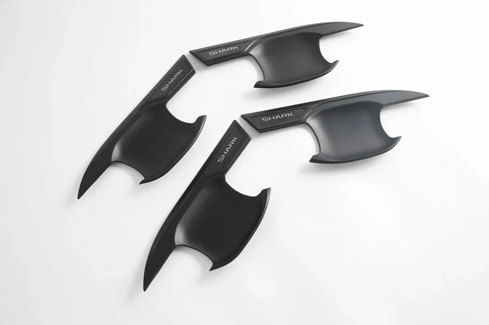 Four matte black shark fin antenna covers with sleek aerodynamic design.