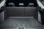 Black heavy-duty rubberized cargo mat and trunk liner protecting a vehicle's interior surface.