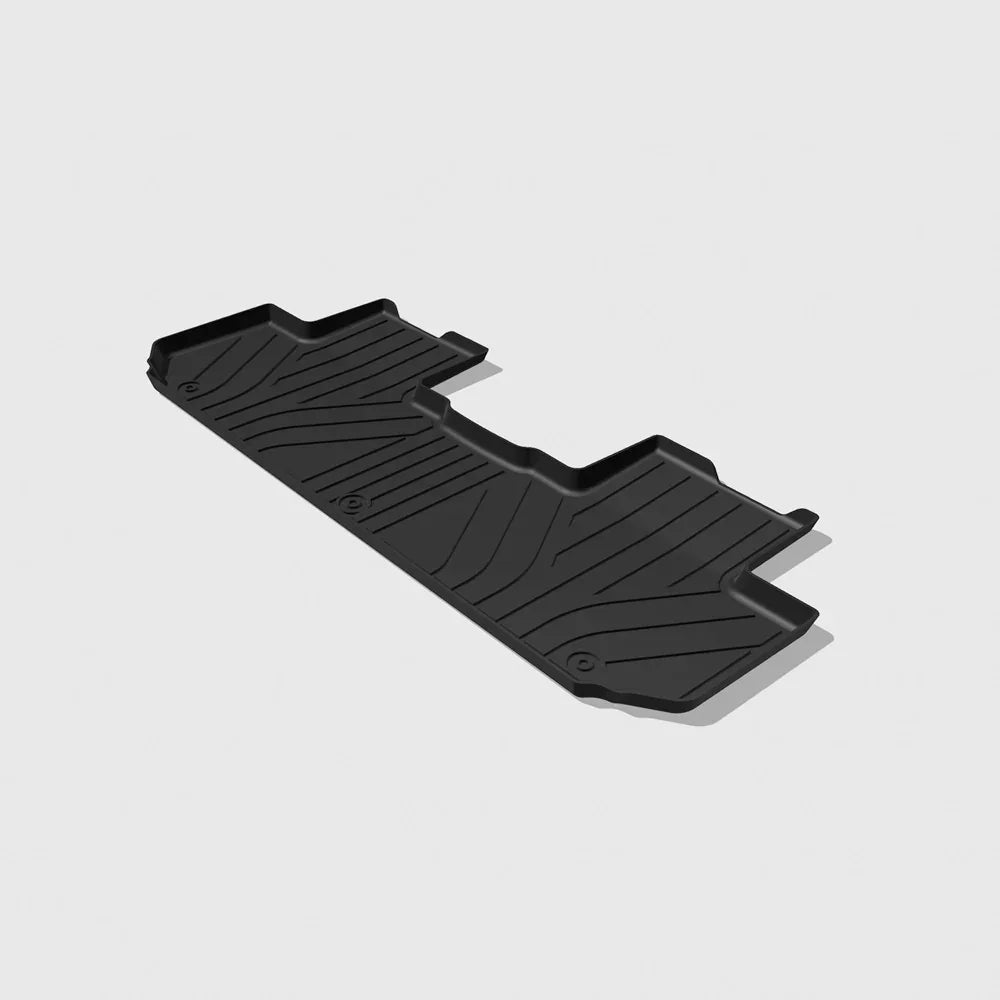 Custom-fit black rubber car cargo liner with deep grooves for spill protection.